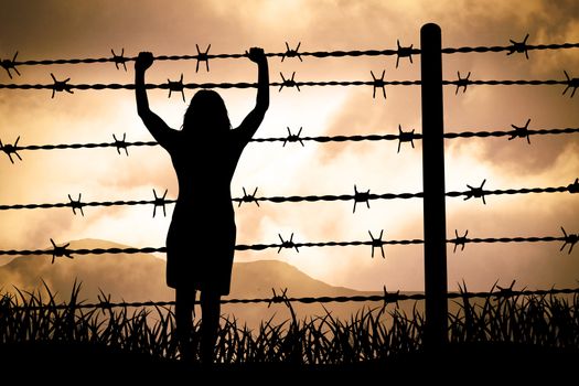 people are captured behind barbed wire