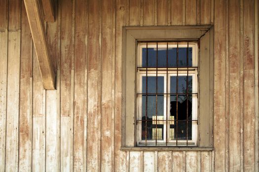 old broken window of a historical jail