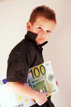 Little Child holding 100 Euro in the hands
