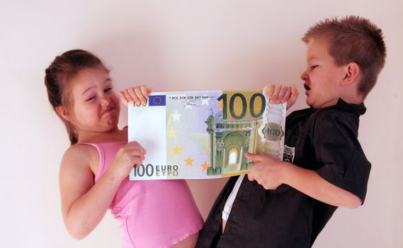 Little Child holding 100 Euro in the hands