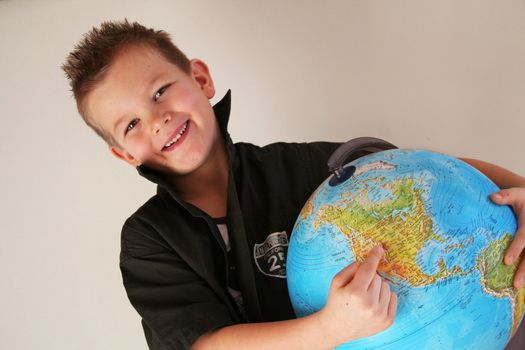 Boy is holding the world in his hands