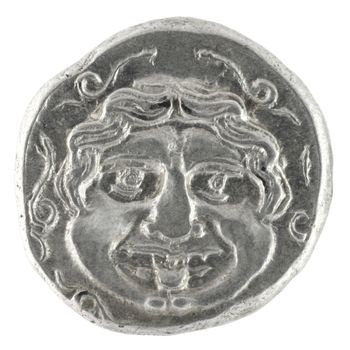 Medusa on ancient Greek half drachm from 300 BC isolated in white