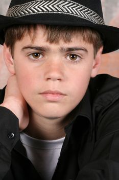 Teenage boy wearing a black hat in casual wear