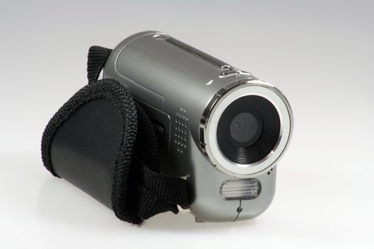 Small silver digital Camera with flashlight