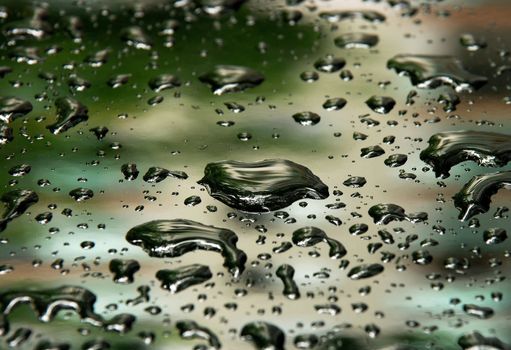 Rain drops photographed on a car window
