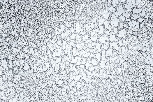 The ugly cracked grey wall background