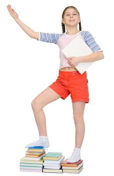 Girl standing on piles of books on a white background