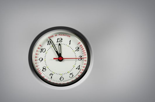 pulsation clock shows the time - five to twelve