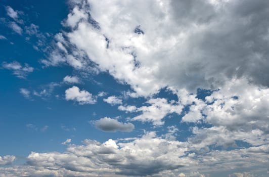 Picturesque dramatic sky with white cumulus clouds 
