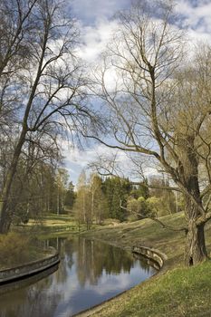 Picturesque river in park at the beginning of spring