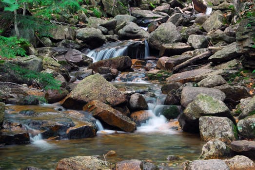 Picture of a natural small water fall in summer