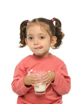 Toddler enjoying a glass of fresh milk