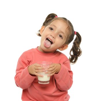 Toddler enjoying a glass of fresh milk