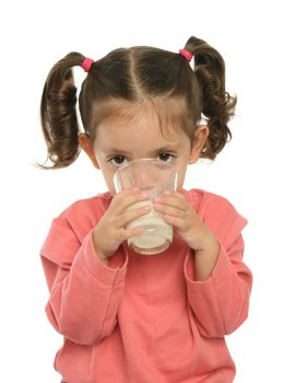 Toddler enjoying a glass of fresh milk