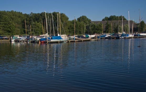 Blue sky, blue water and a small marina in the summer sun