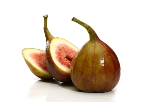 Delicious fig sliced over a white background