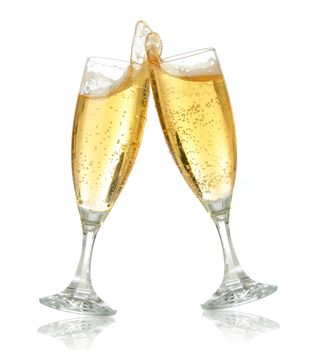 Pair of champagne flutes making a toast. Champagne splash