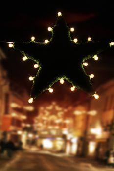 bright christmas star in the dark streets