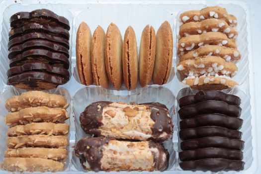 Assorted chocolate and almond cookies in a presentation box