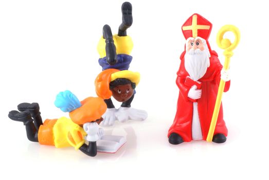 Sinterklaas and black pieten, characters from a traditional dutch holiday; isolated on white.