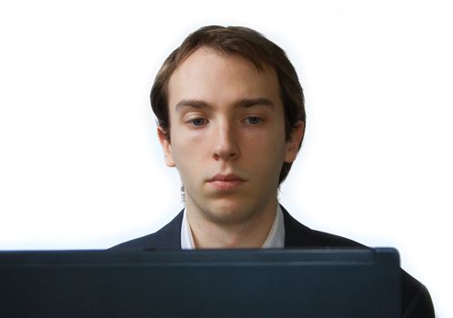 Close up of young man working on laptop, isolated over white