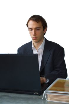 Young man works on laptop, isolated over white