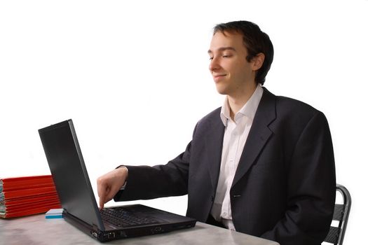 Young man proudly finishes work on laptop, isolated over white