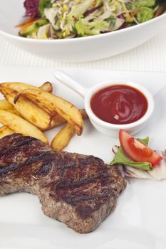 steak and french fries on a plate