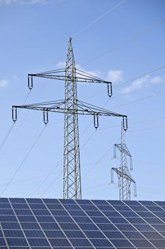 solar panels and a pylon on a sunny day