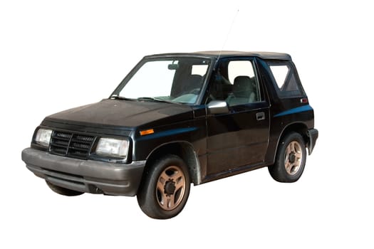 This is a 1990s small black four wheel drive vehicle wiith a convertible top