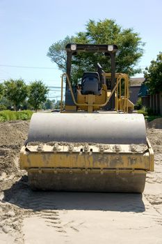 This is a large highway construction packing roller used to pack sand and aggregates before the laying of asphalt. 