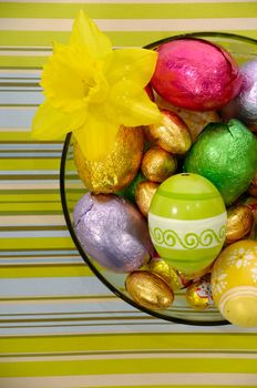 Easter eggs in bowl and flower