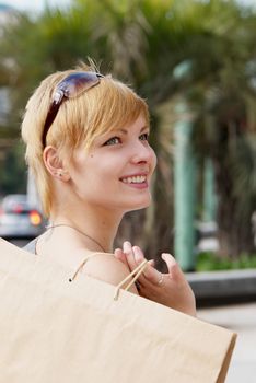 Portrait of an attractive young  girl  with a shopping Bag