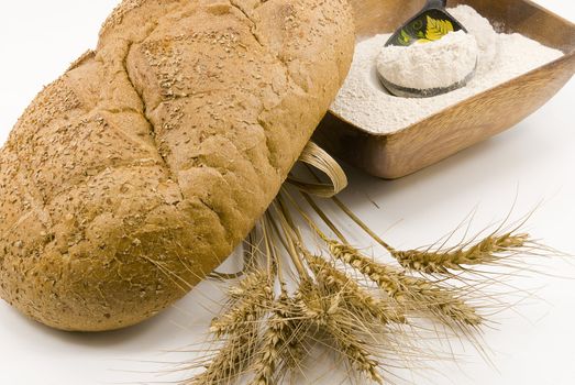 
Loaf of bread , flour and wheat , the stems of wheat