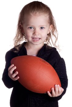 A child is holding a football asking the viewer if they would like to play too.