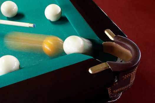 The sphere which slides in a billiard pocket