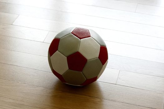 A Soccer ball on wood tile background