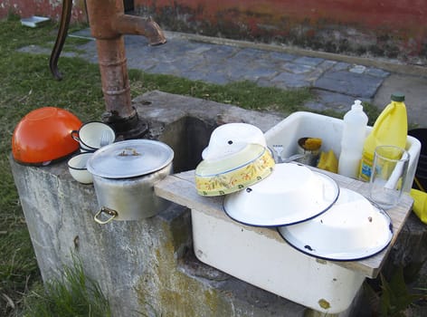 sink of field with pots and plates 