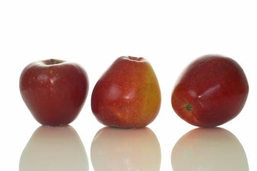 Three big fresh red apples with reflection