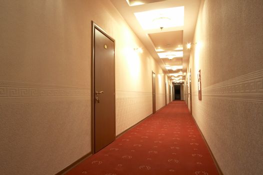 Corridor with a red carpet in hotel 