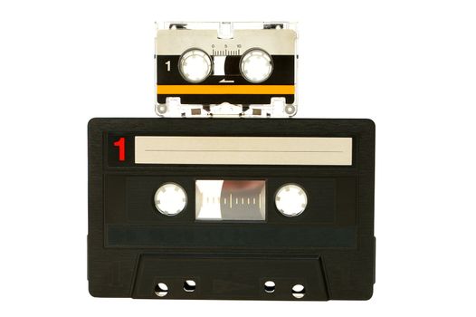 Big and small cassette tape isolated on white