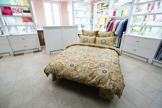 Modern and beautiful bed in shop of bed-clothes