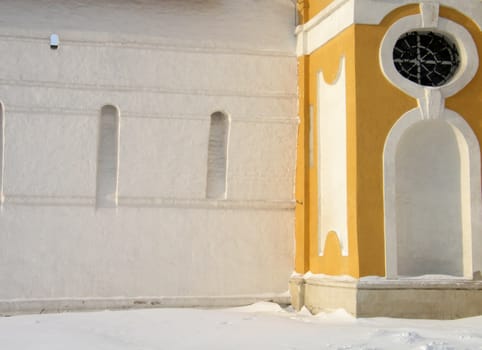 Wall of old russian monastery in winter