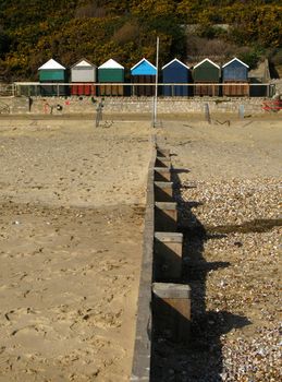 Beach groyne leading to beach huts
