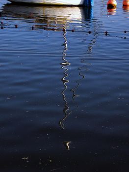 Mast reflection on rippled water