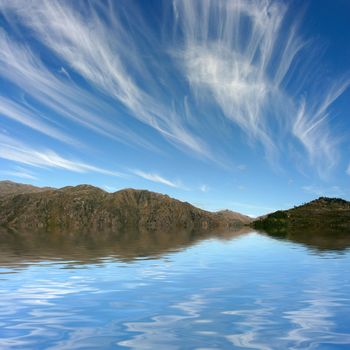 Photo of a dreamy sky, reflected on water.