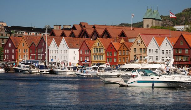 Old buildings with boats at the seaside in Bergen city of Norway