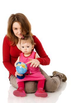 Happy mother holding globe with daughter isolated on white