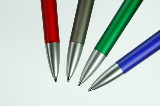 four pens in different colours for writings