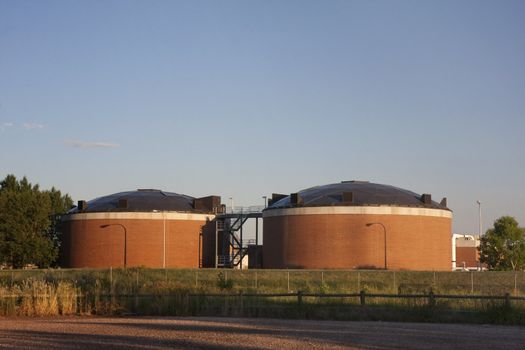 two brick round biotower structures at water reclamation facility, Fort Collins, Colorado